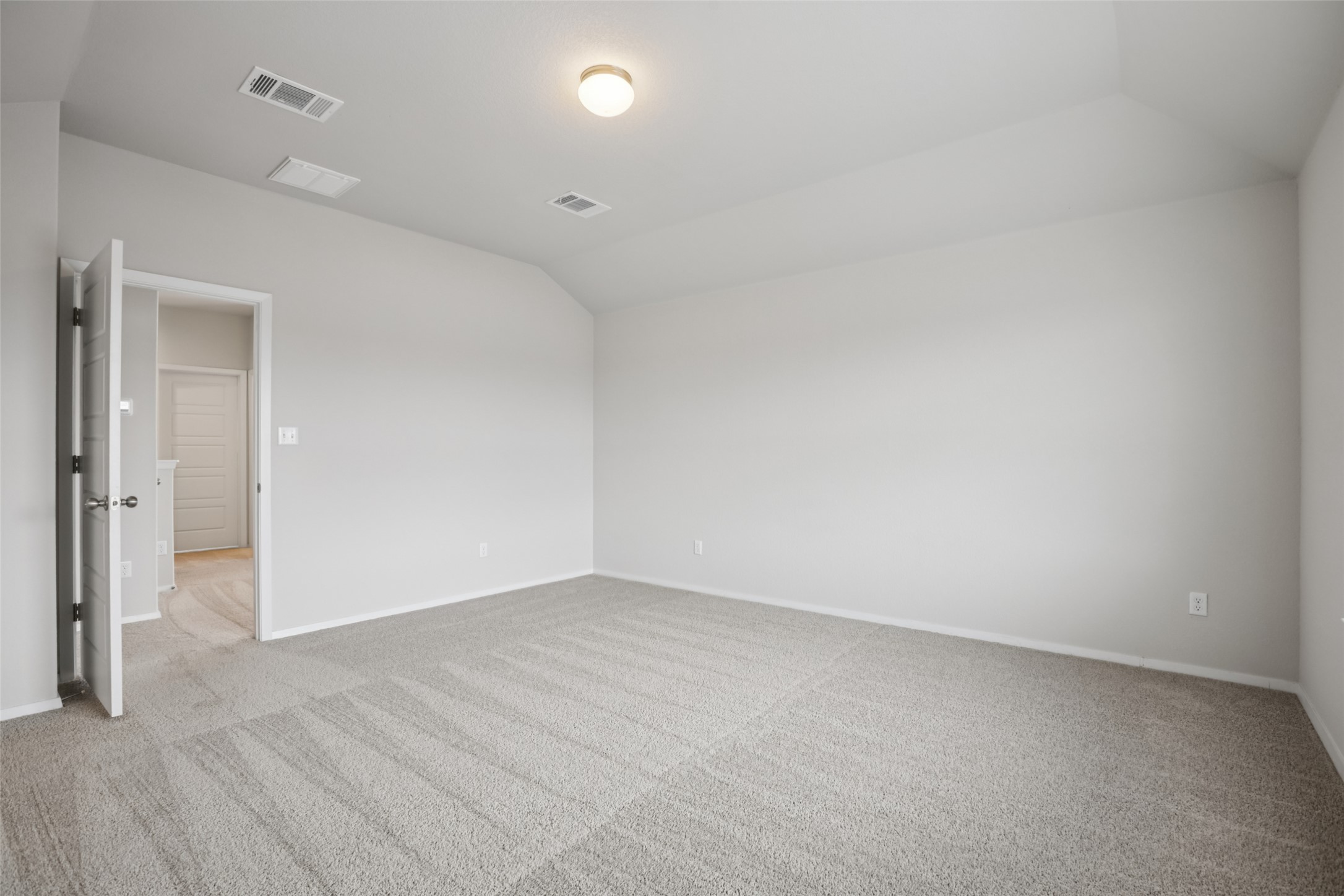 293 Gaida Loop Georgetown, TX 78628 - Photo 8 of 39 an empty room with wooden floor and windows