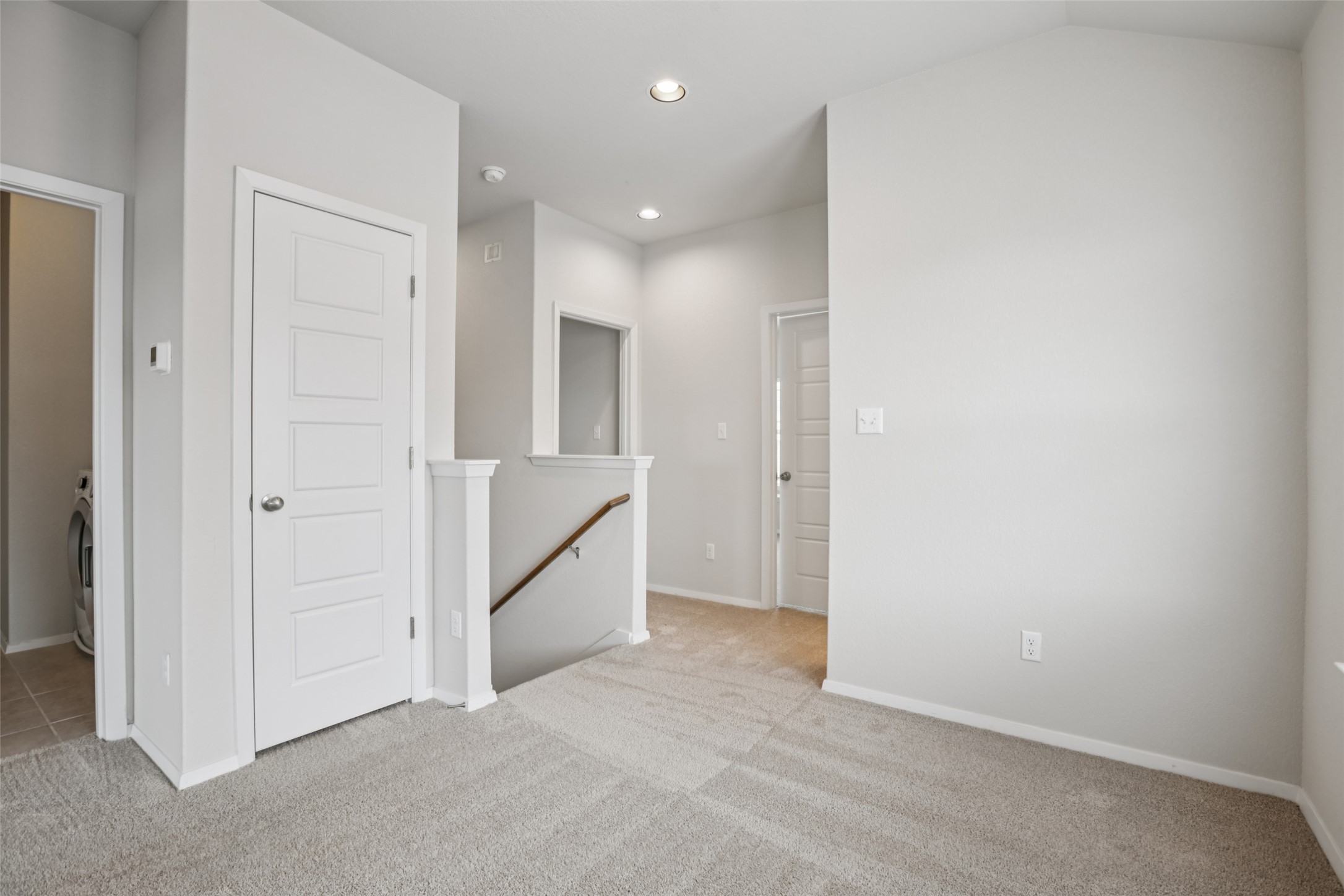293 Gaida Loop Georgetown, TX 78628 - Photo 9 of 39 a view of an empty room and a gallery