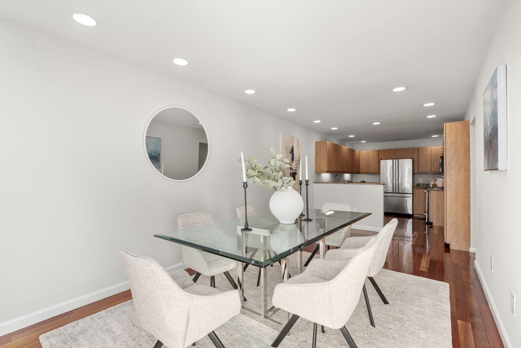 553 Boylston Street, Unit C2 Brookline, MA 02445 - Photo 11 of 31 a dining room with furniture and a mirror