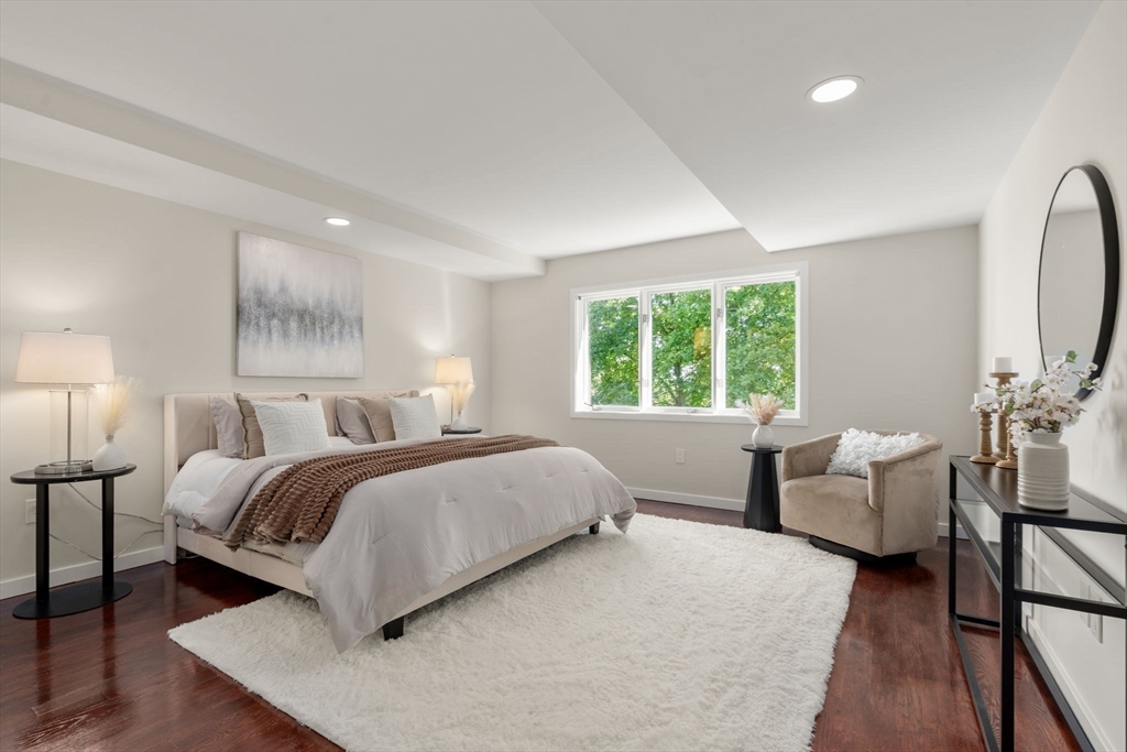 553 Boylston Street, Unit C2 Brookline, MA 02445 - Photo 12 of 31 a bedroom with a bed and a couch
