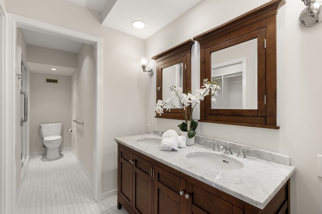 553 Boylston Street, Unit C2 Brookline, MA 02445 - Photo 14 of 31 a bathroom with a sink and a mirror