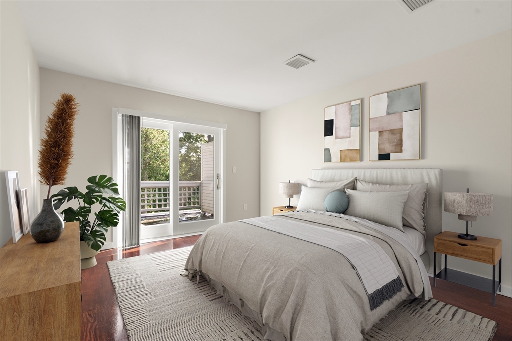 553 Boylston Street, Unit C2 Brookline, MA 02445 - Photo 16 of 31 a bedroom with a large bed and a potted plant