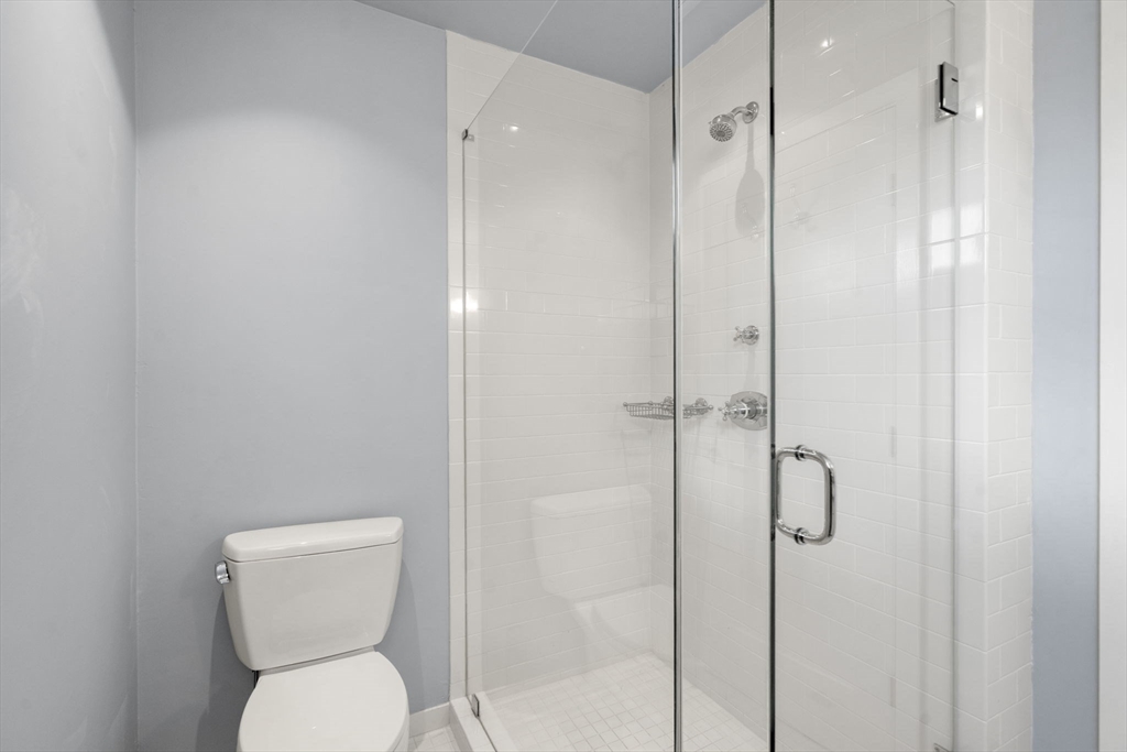 553 Boylston Street, Unit C2 Brookline, MA 02445 - Photo 21 of 31 a bathroom with a toilet and a shower