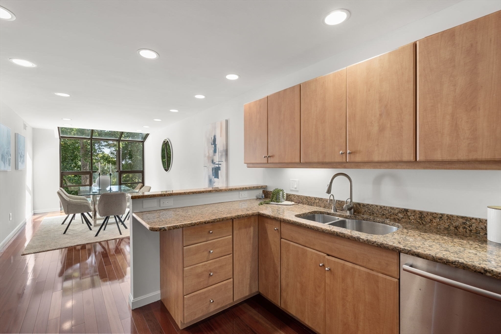 553 Boylston Street, Unit C2 Brookline, MA 02445 - Photo 8 of 31 a kitchen with a sink cabinets and window