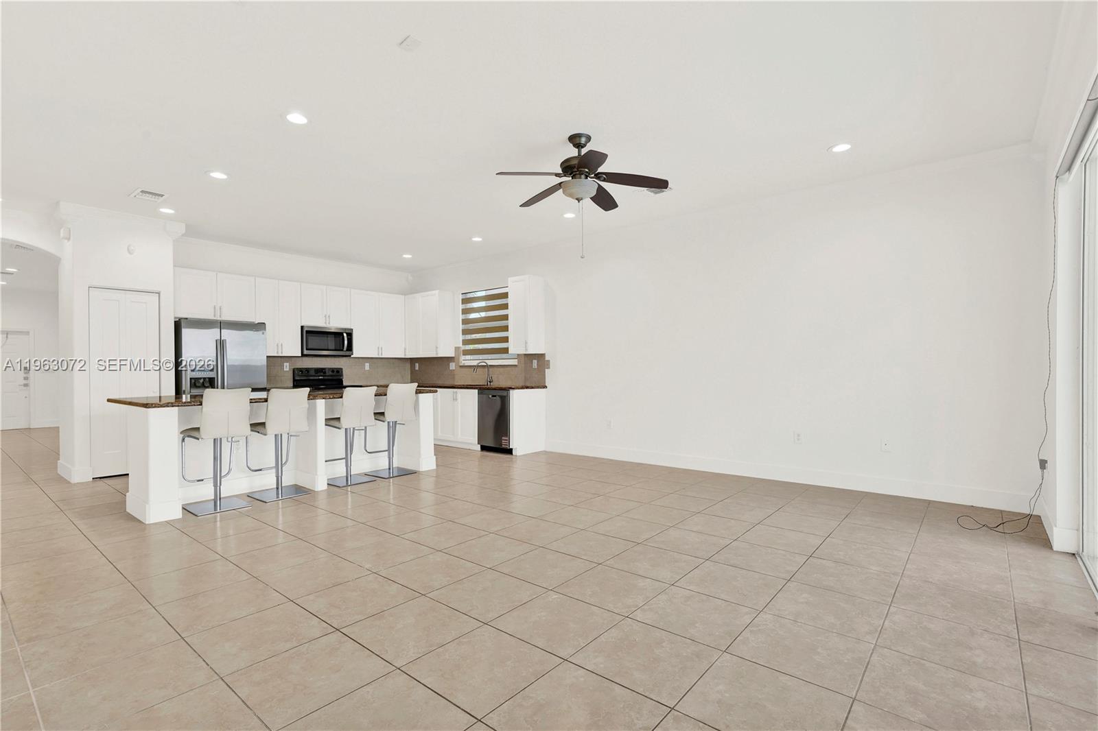 23824 Southwest 107th Place Homestead, FL 33032 - Photo 12 of 33 a view of kitchen with furniture and refrigerator