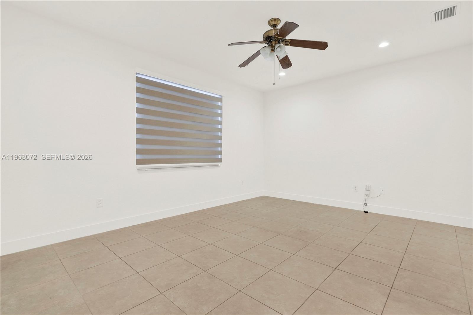 23824 Southwest 107th Place Homestead, FL 33032 - Photo 19 of 33 a view of an empty room with a window