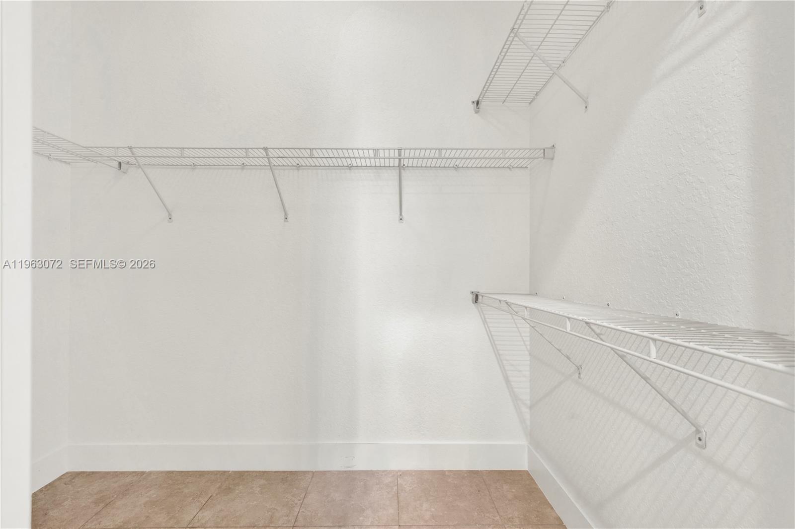 23824 Southwest 107th Place Homestead, FL 33032 - Photo 22 of 33 a view of walk in closet