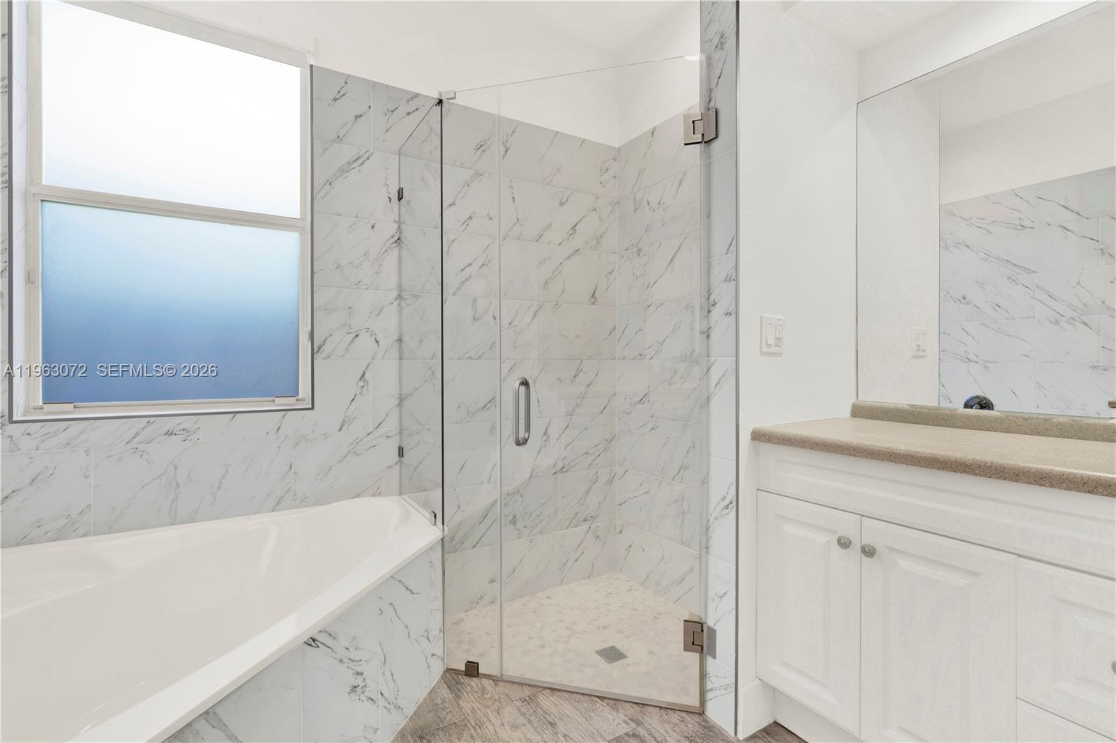 23824 Southwest 107th Place Homestead, FL 33032 - Photo 24 of 33 a bathroom with a bathtub and a shower