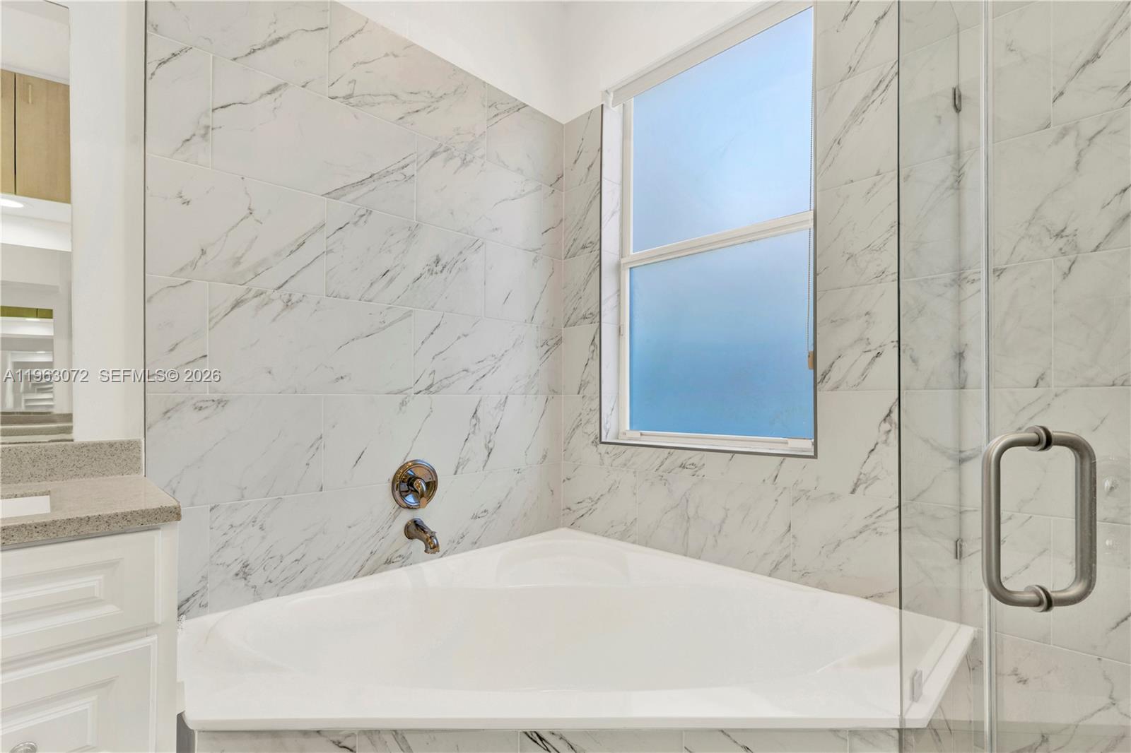 23824 Southwest 107th Place Homestead, FL 33032 - Photo 26 of 33 a bathroom with a tub and shower