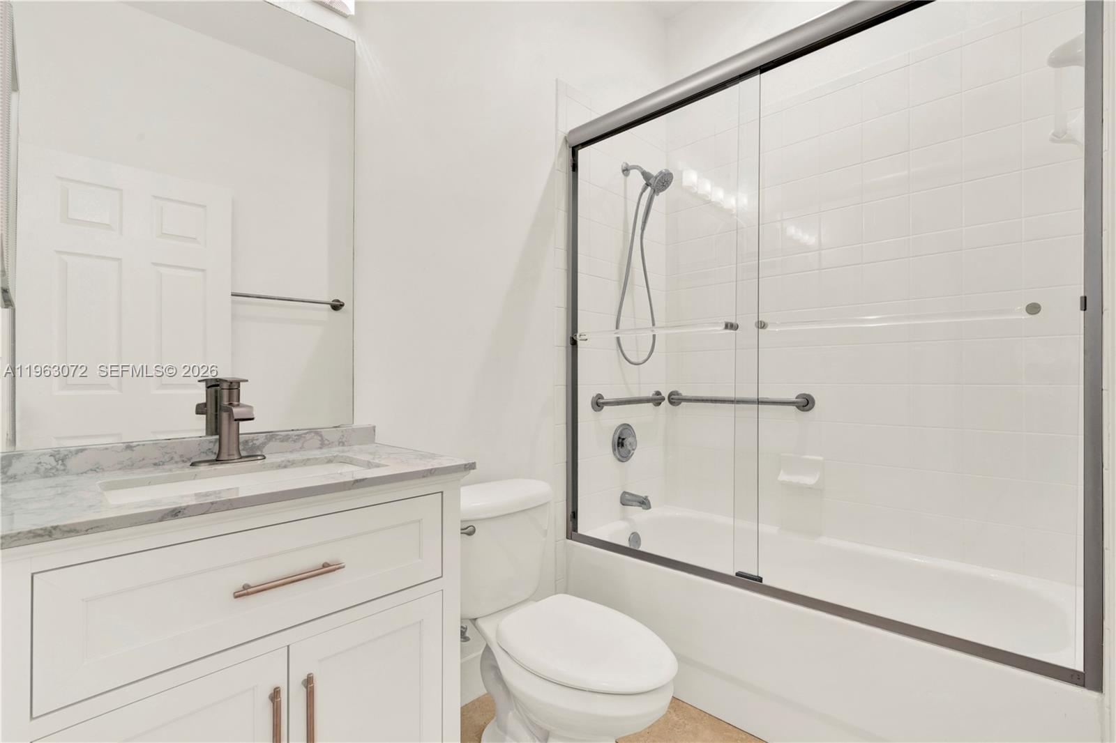 23824 Southwest 107th Place Homestead, FL 33032 - Photo 28 of 33 a bathroom with a granite countertop sink toilet and shower