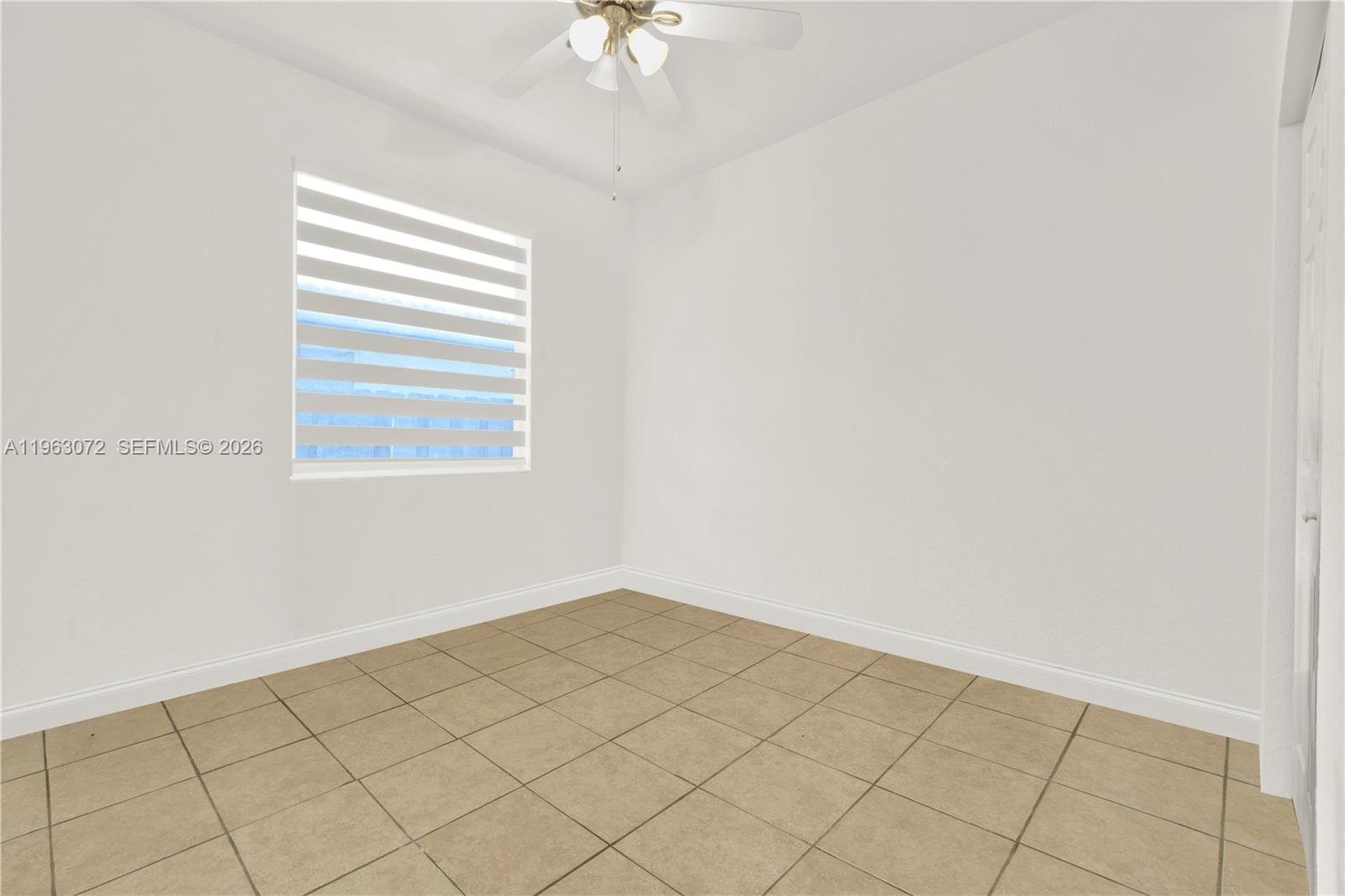 23824 Southwest 107th Place Homestead, FL 33032 - Photo 30 of 33 a view of a room that has a window in it