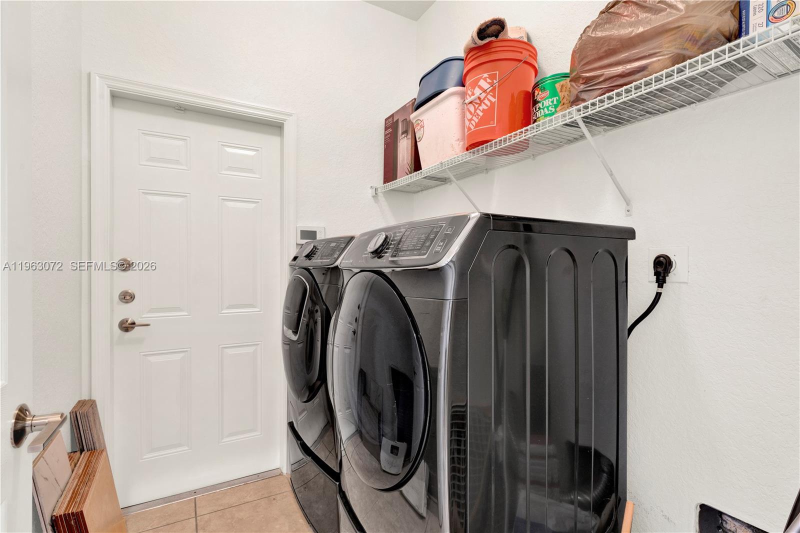 23824 Southwest 107th Place Homestead, FL 33032 - Photo 31 of 33 a utility room with dryer and washer
