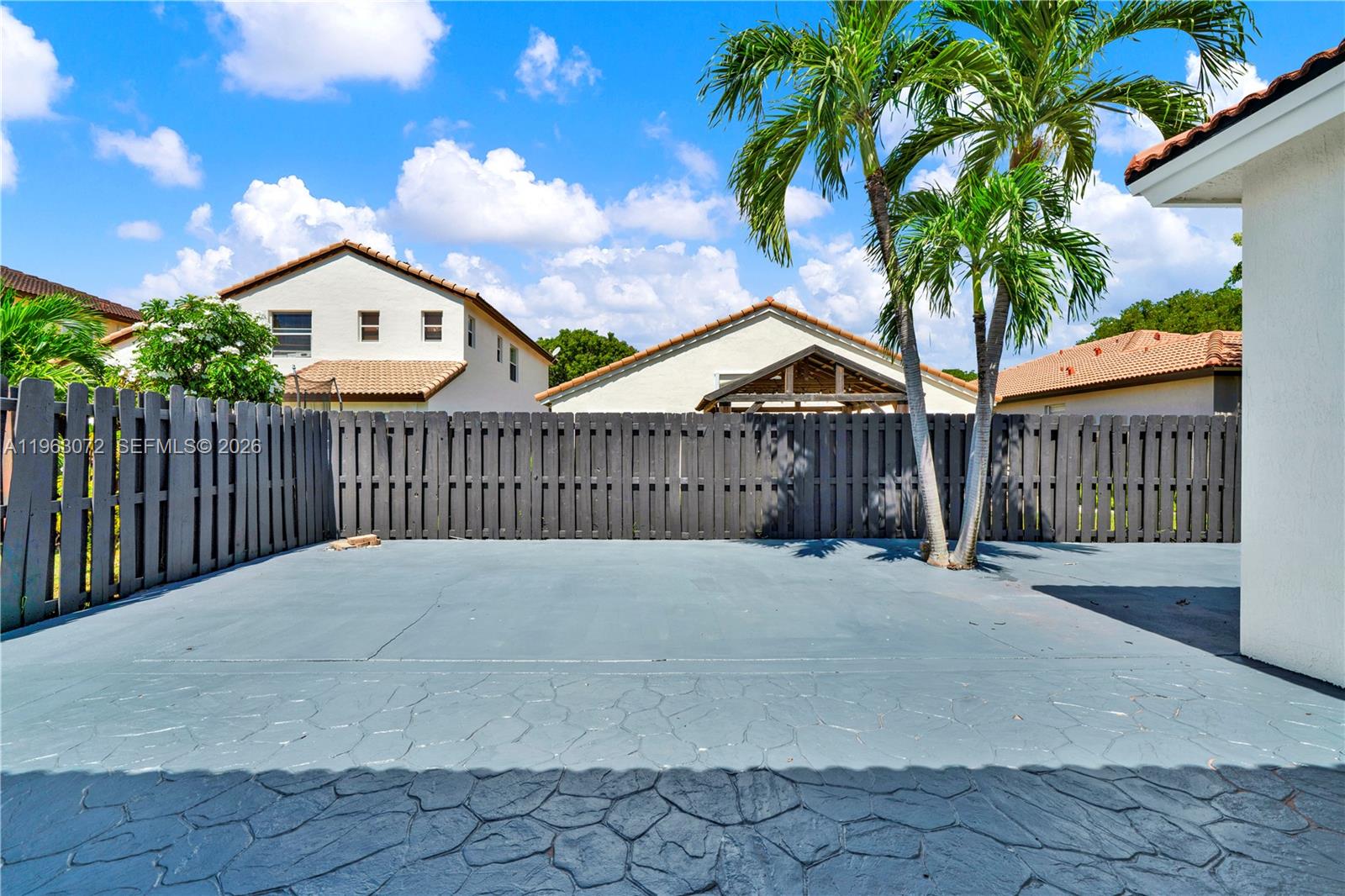 23824 Southwest 107th Place Homestead, FL 33032 - Photo 4 of 33 a view of wooden house with a wooden fence