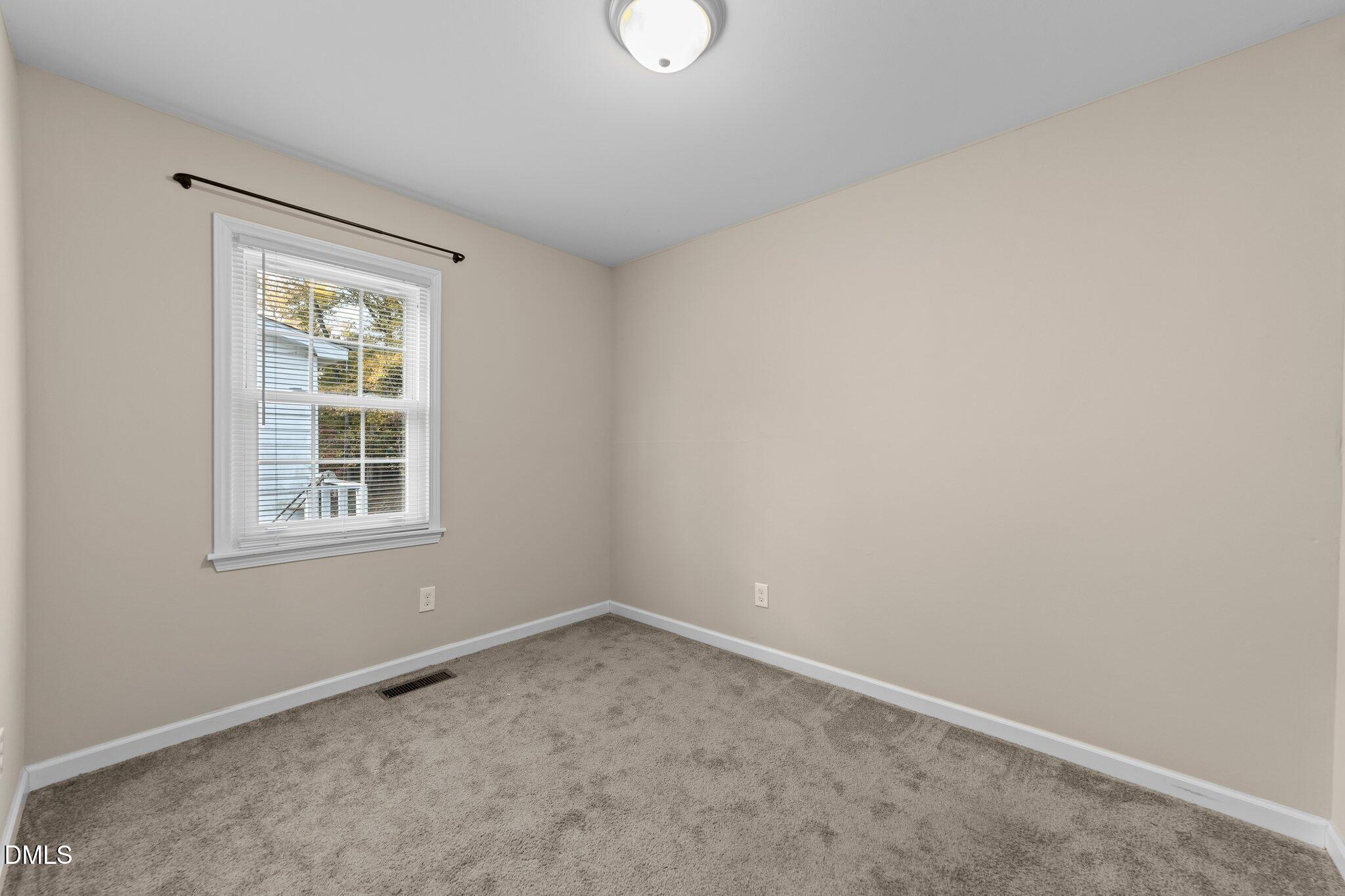412 2nd Street Apex, NC 27502 - Photo 10 of 39 an empty room with a window