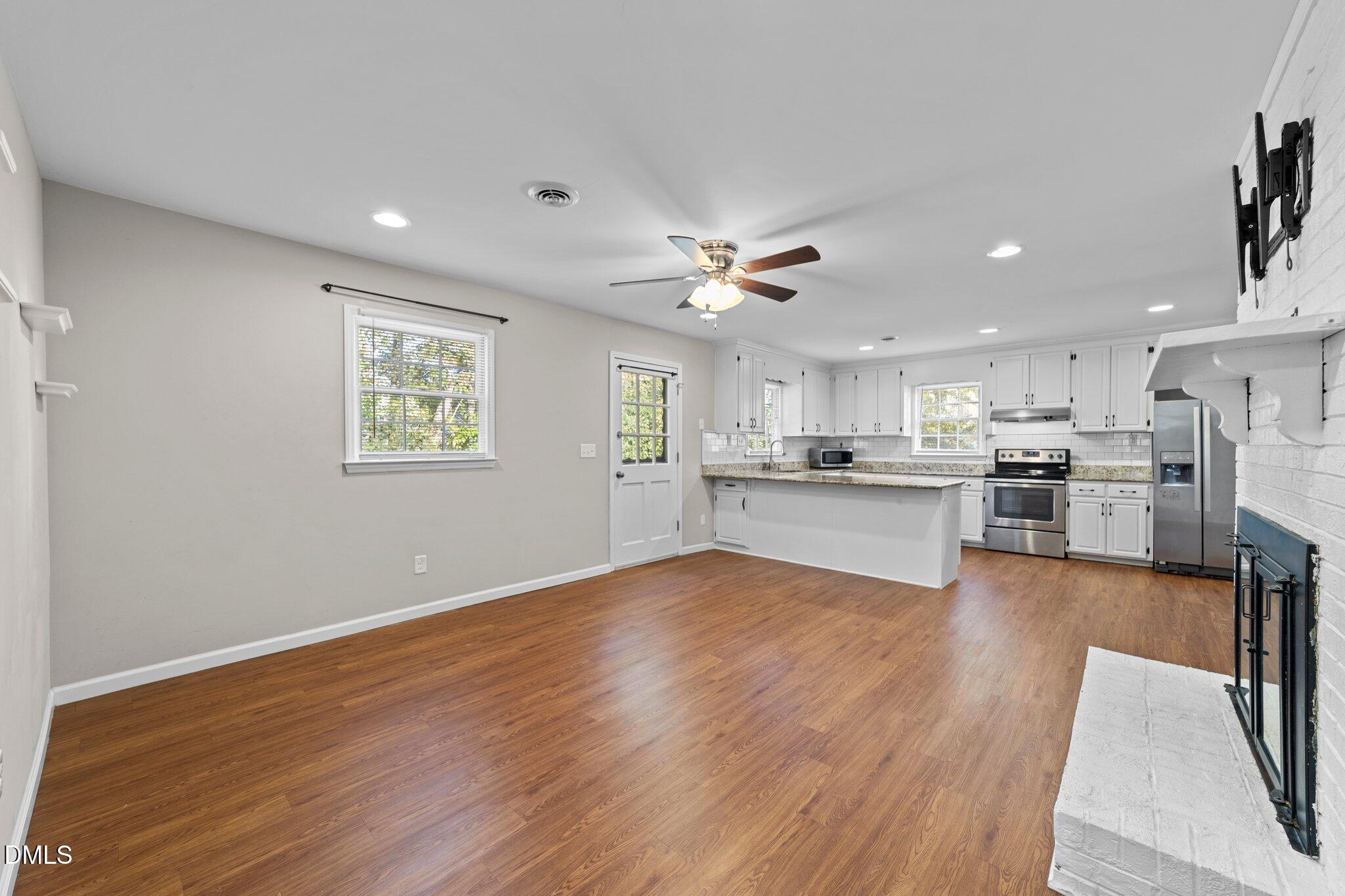 412 2nd Street Apex, NC 27502 - Photo 15 of 39 a view of kitchen with wooden floor and windows
