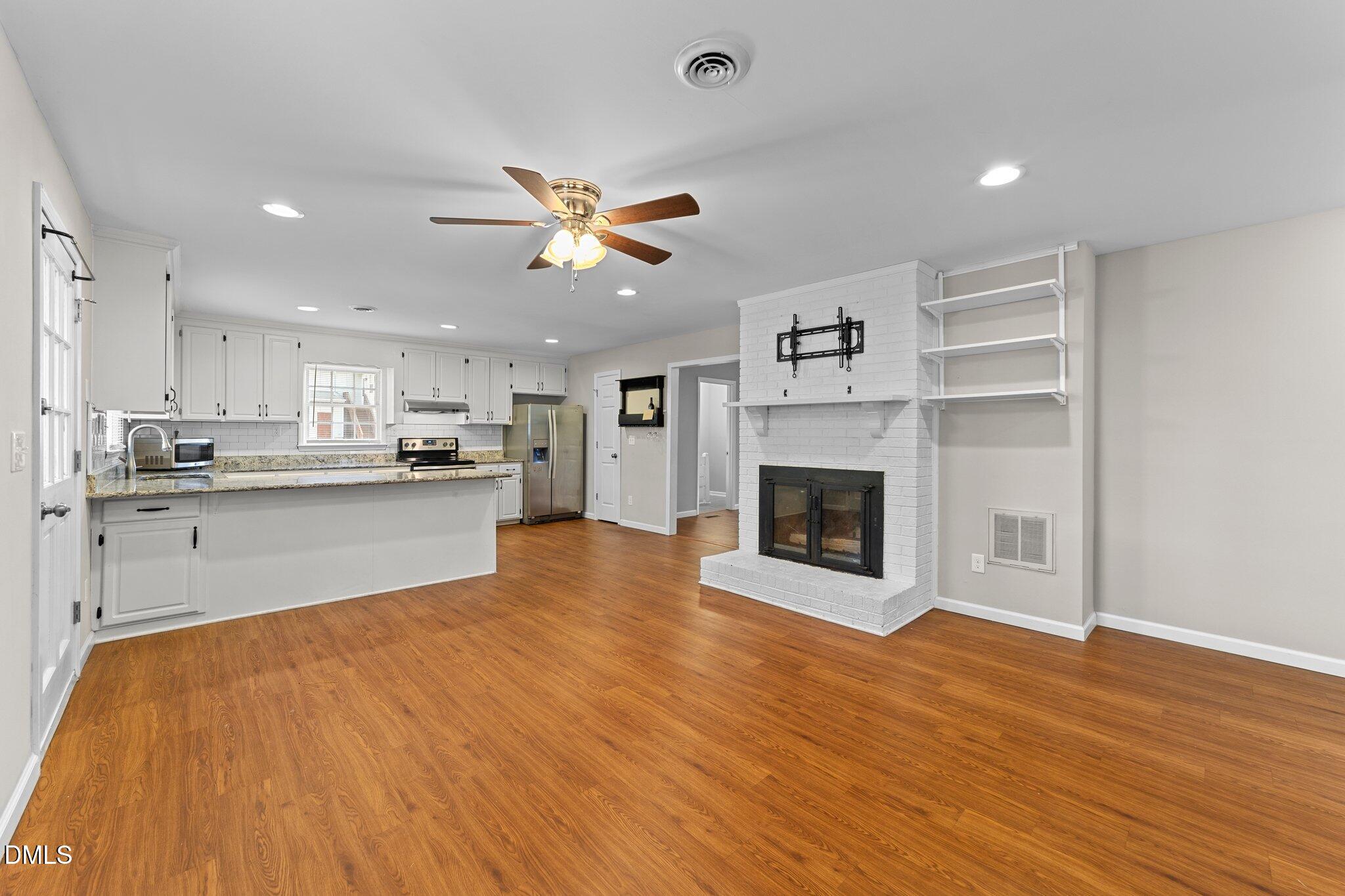 412 2nd Street Apex, NC 27502 - Photo 16 of 39 a view of kitchen with cabinets and wooden floor