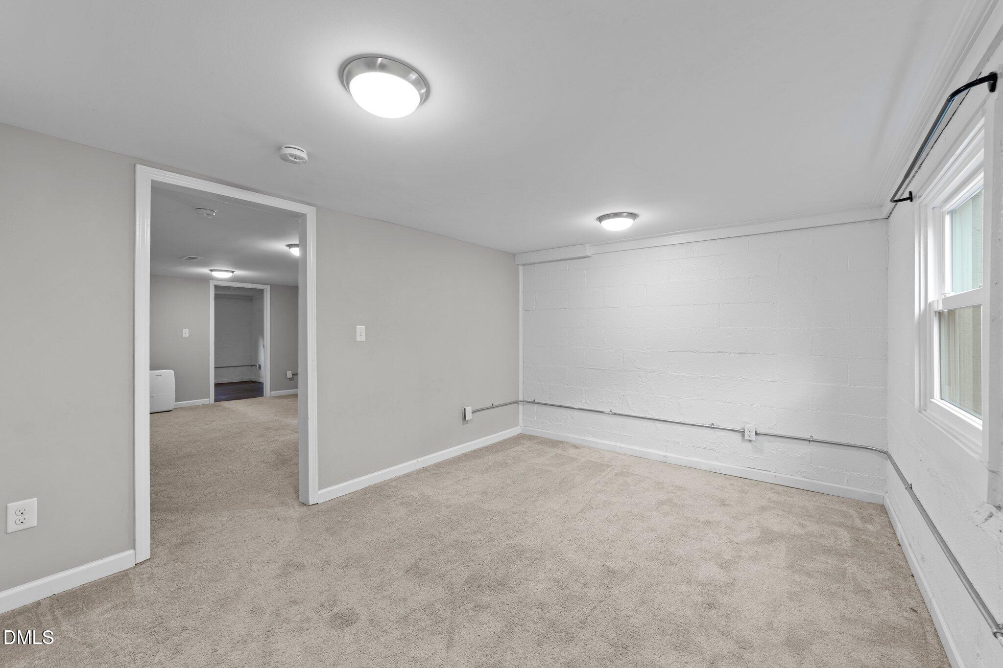 412 2nd Street Apex, NC 27502 - Photo 20 of 39 wooden floor in an empty room with a window