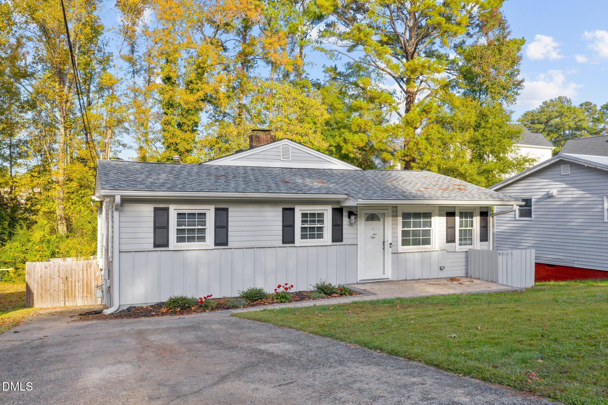 412 2nd Street Apex, NC 27502 - Photo 26 of 39 a front view of a house with a yard and garage