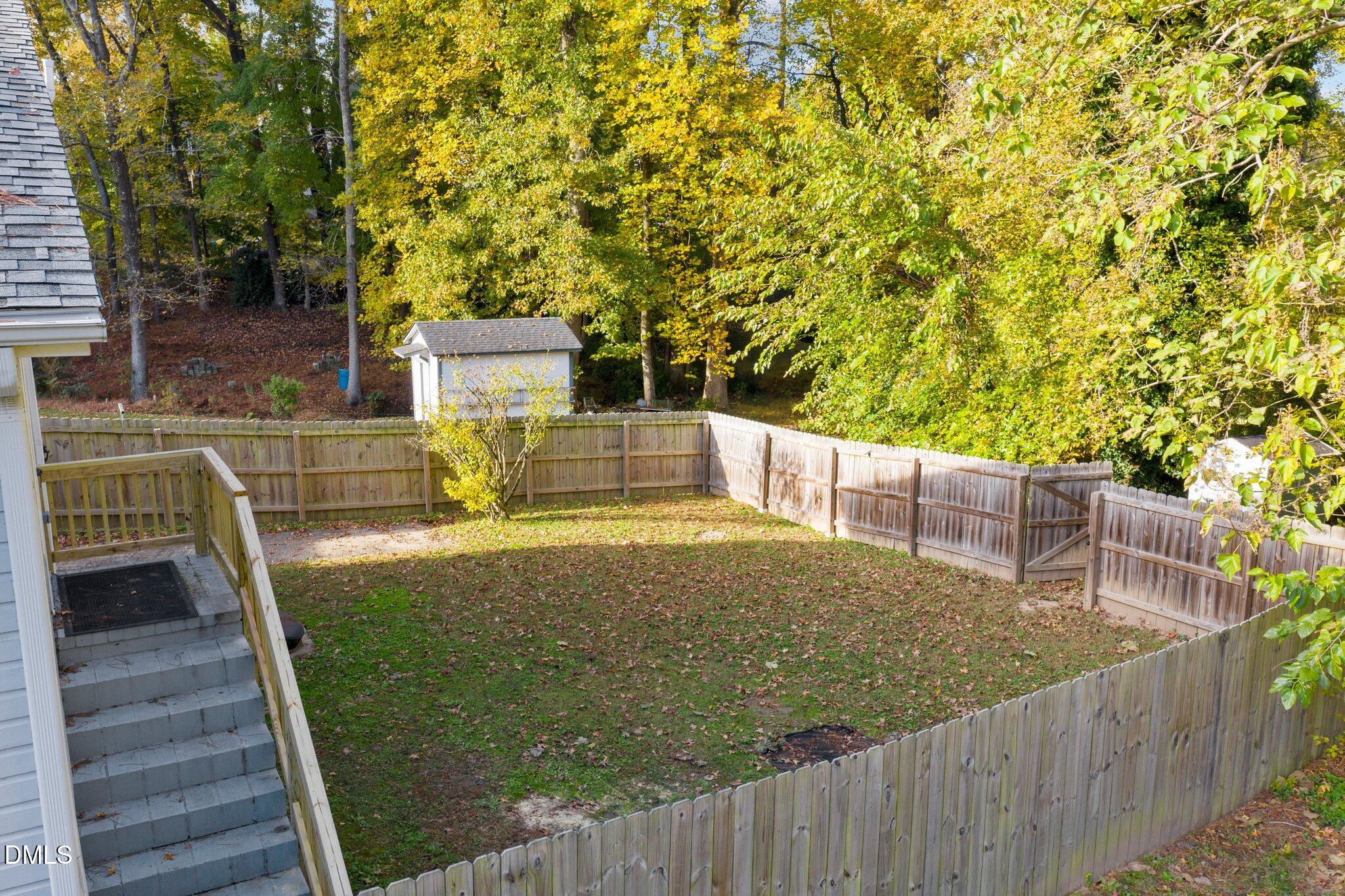 412 2nd Street Apex, NC 27502 - Photo 30 of 39 a view of a balcony with floor to ceiling window and wooden fence