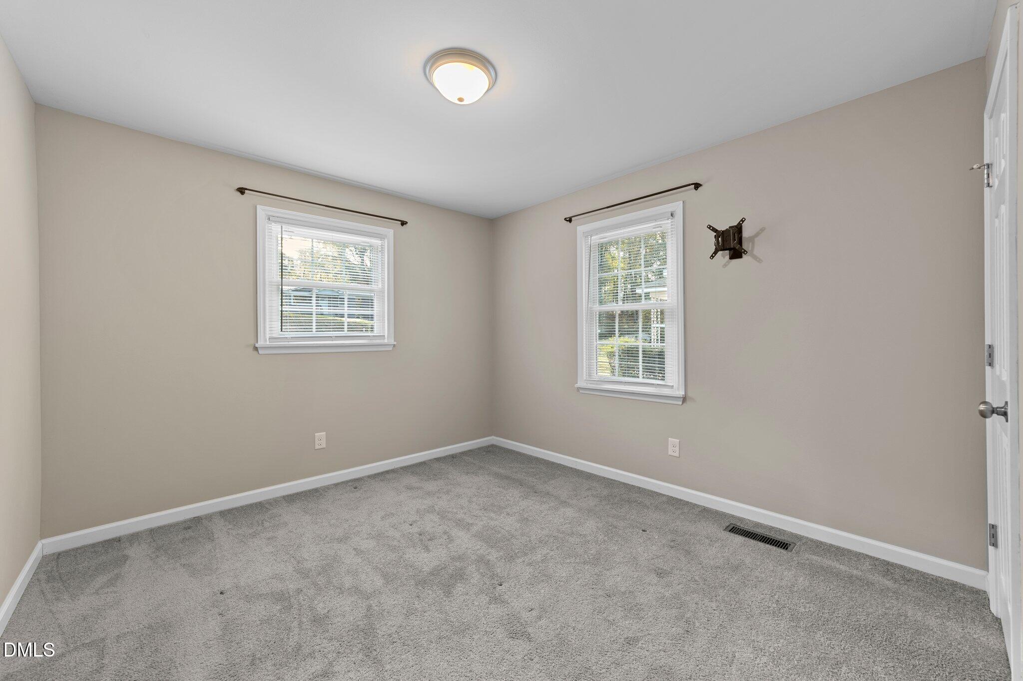 412 2nd Street Apex, NC 27502 - Photo 8 of 39 an empty room with windows
