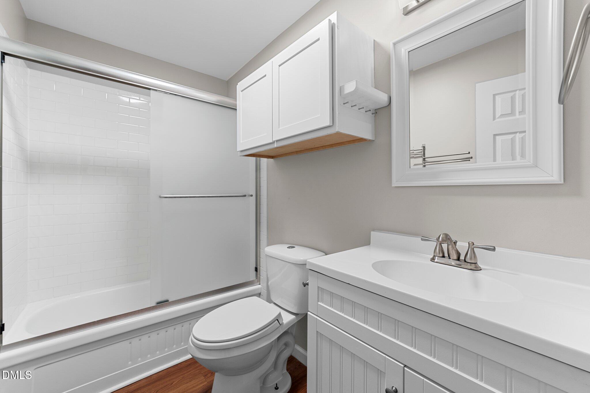 412 2nd Street Apex, NC 27502 - Photo 9 of 39 a bathroom with a sink a toilet and shower