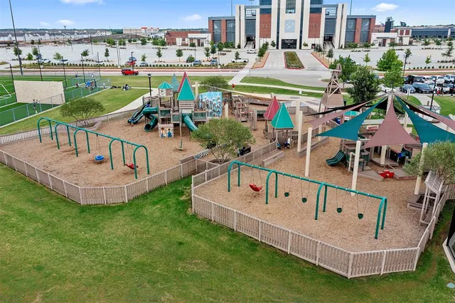 a view of a garden with a building in the background