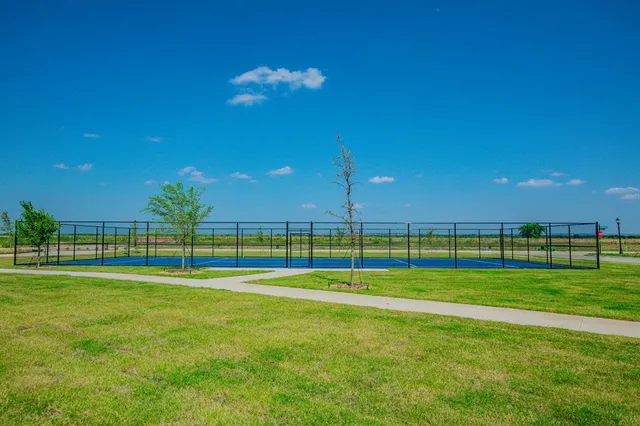 a view of swimming pool with outdoor seating