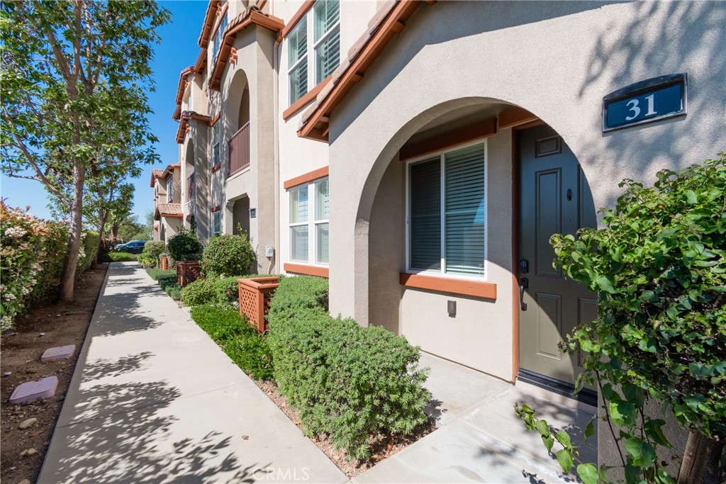 31 Sevilla Rancho Santa Margarita, CA 92688 - Photo 1 of 1 a front view of a house with a garden