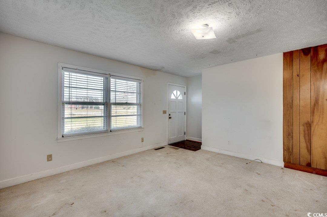 3701 South Green Sea Road Loris, SC 29569 - Photo 2 of 31 Carpeted foyer entrance with a textured ceiling