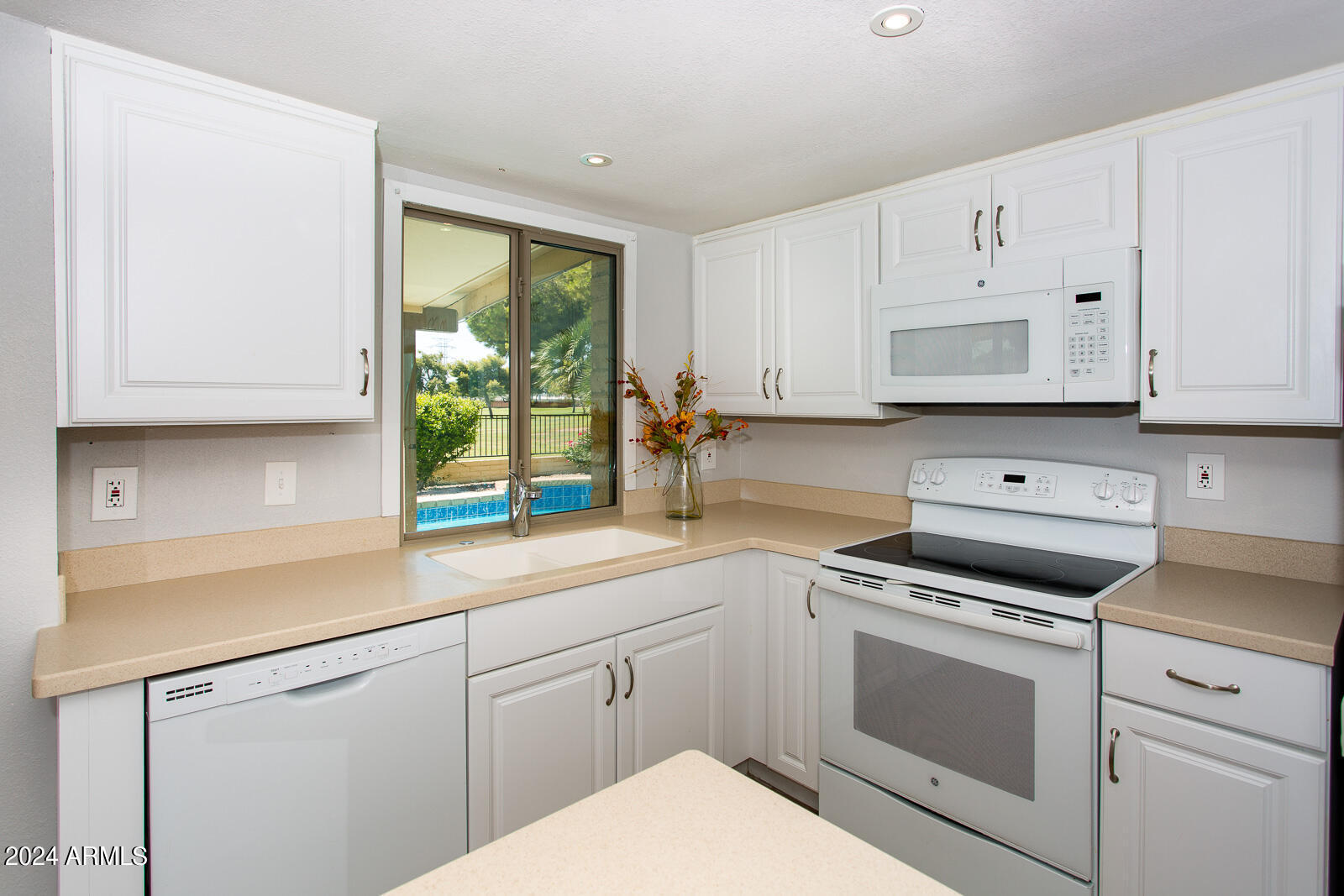7232 South La Rosa Drive Tempe, AZ 85283 - Photo 1 of 12 a kitchen with appliances cabinets and a window
