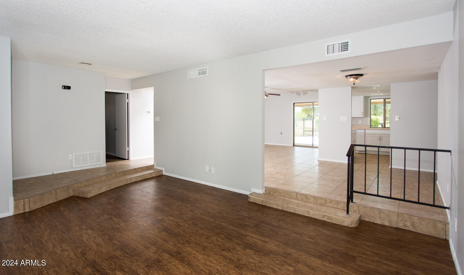 7232 South La Rosa Drive Tempe, AZ 85283 - Photo 12 of 12 an empty room with wooden floor and windows