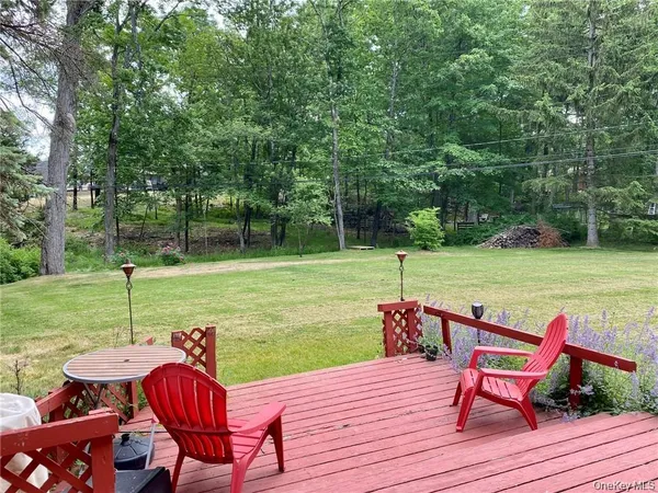 a view of a table and chairs on the deck