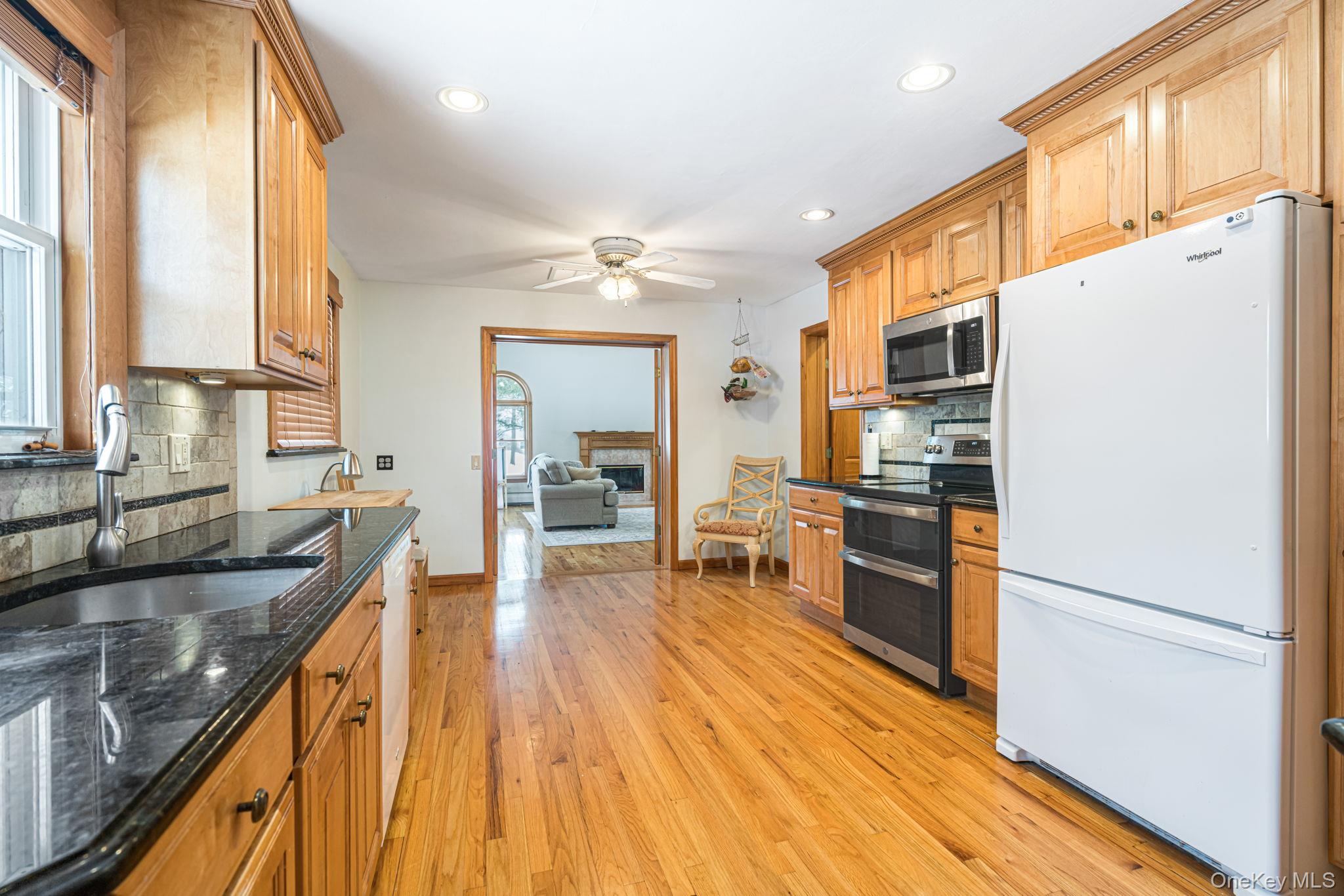 98 Ludlam Road Monroe, NY 10950 - Photo 8 of 21 a kitchen with stainless steel appliances granite countertop a sink stove and refrigerator