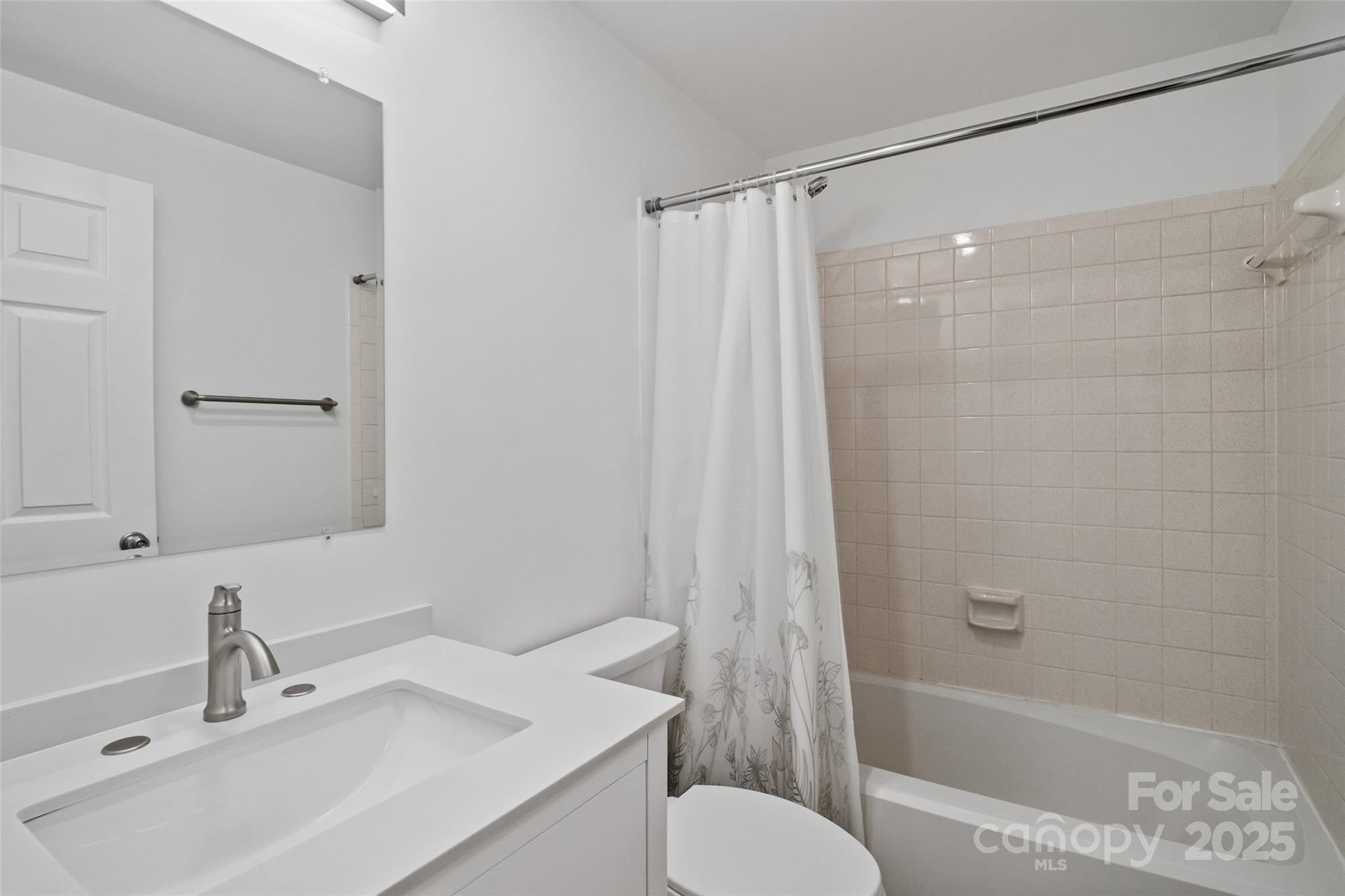 5709 Shadow Creek Road Charlotte, NC 28226 - Photo 21 of 39 a bathroom with a sink toilet and shower