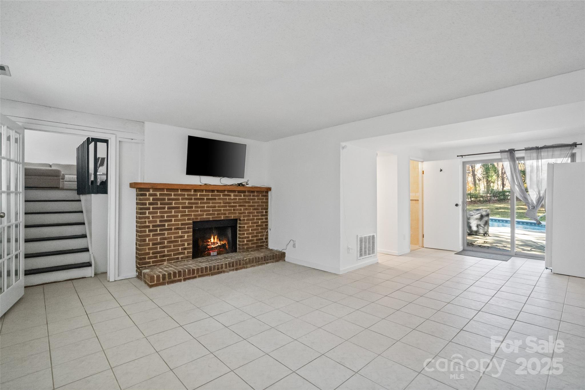 5709 Shadow Creek Road Charlotte, NC 28226 - Photo 23 of 39 a view of a livingroom with a fireplace and window