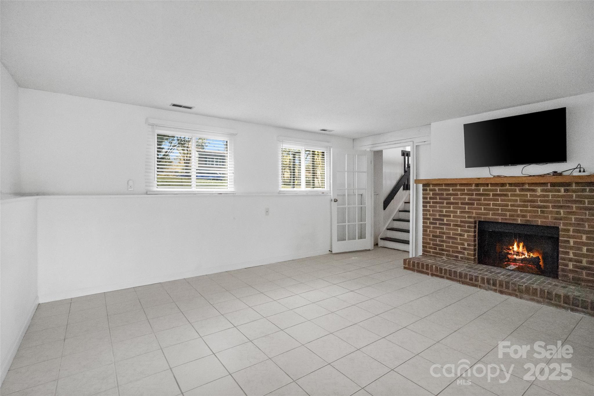 5709 Shadow Creek Road Charlotte, NC 28226 - Photo 24 of 39 a view of an empty room with a fireplace