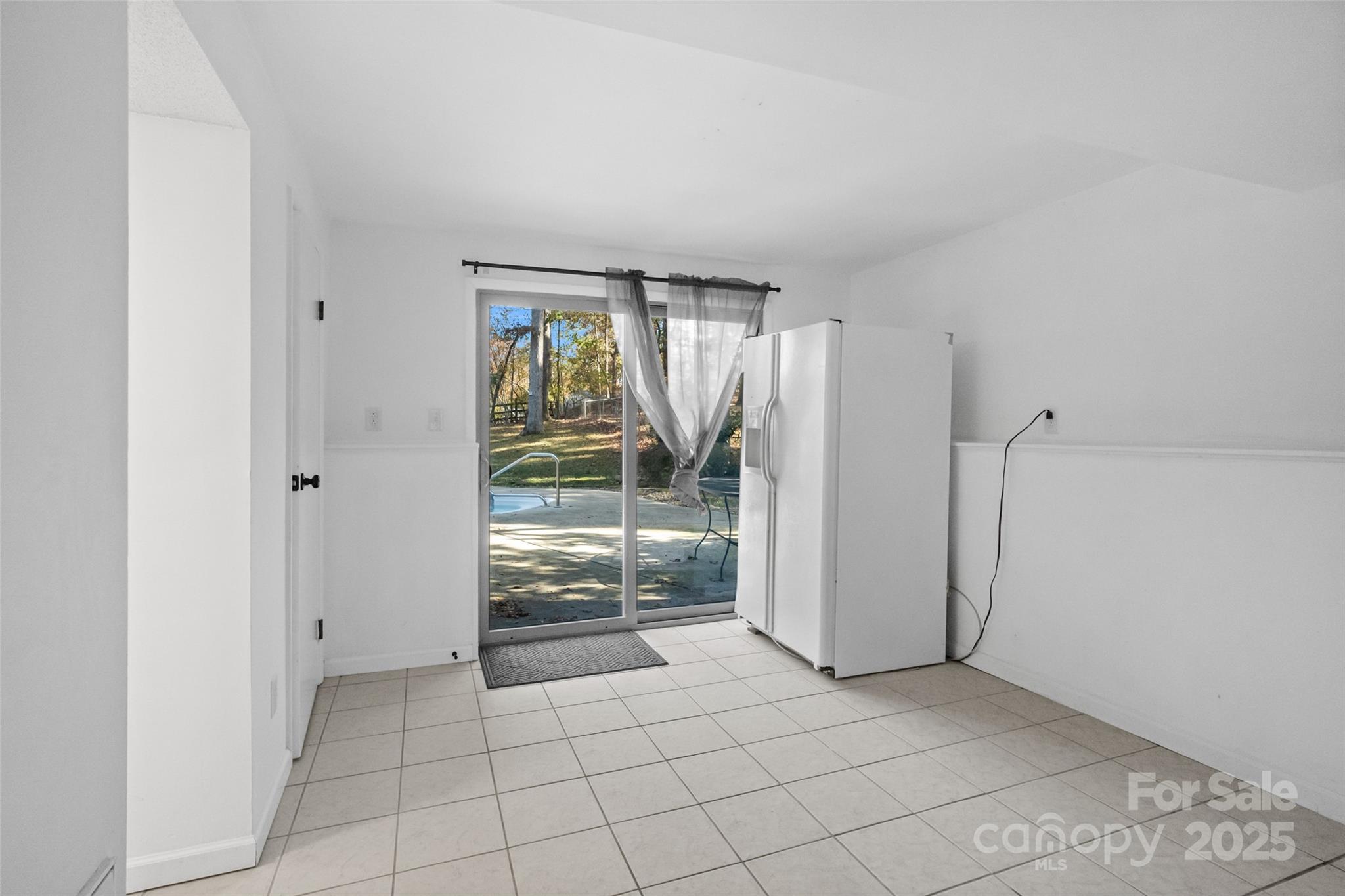 5709 Shadow Creek Road Charlotte, NC 28226 - Photo 25 of 39 a view of an empty room with a fireplace