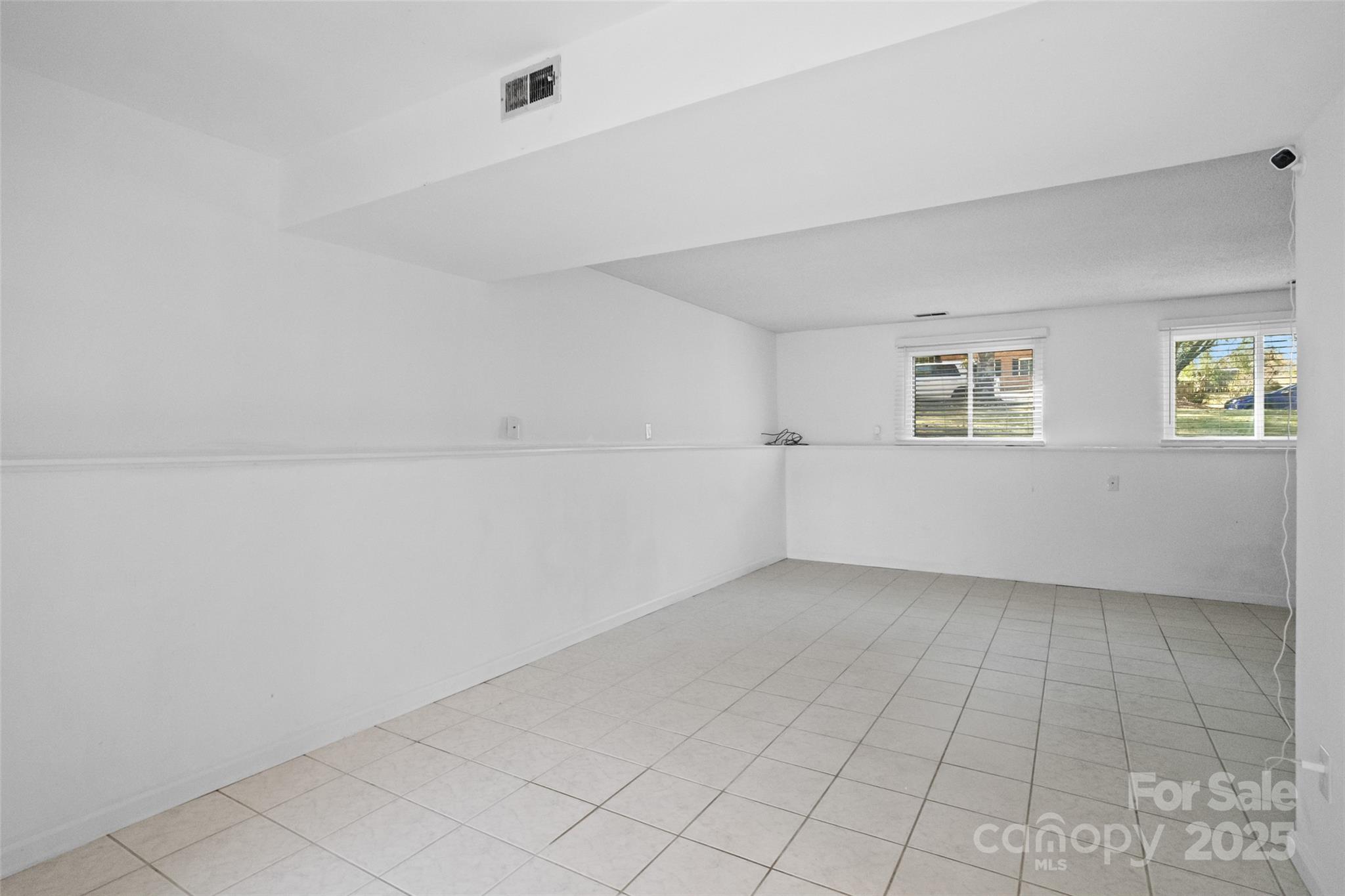 5709 Shadow Creek Road Charlotte, NC 28226 - Photo 26 of 39 a view of an empty room with a window