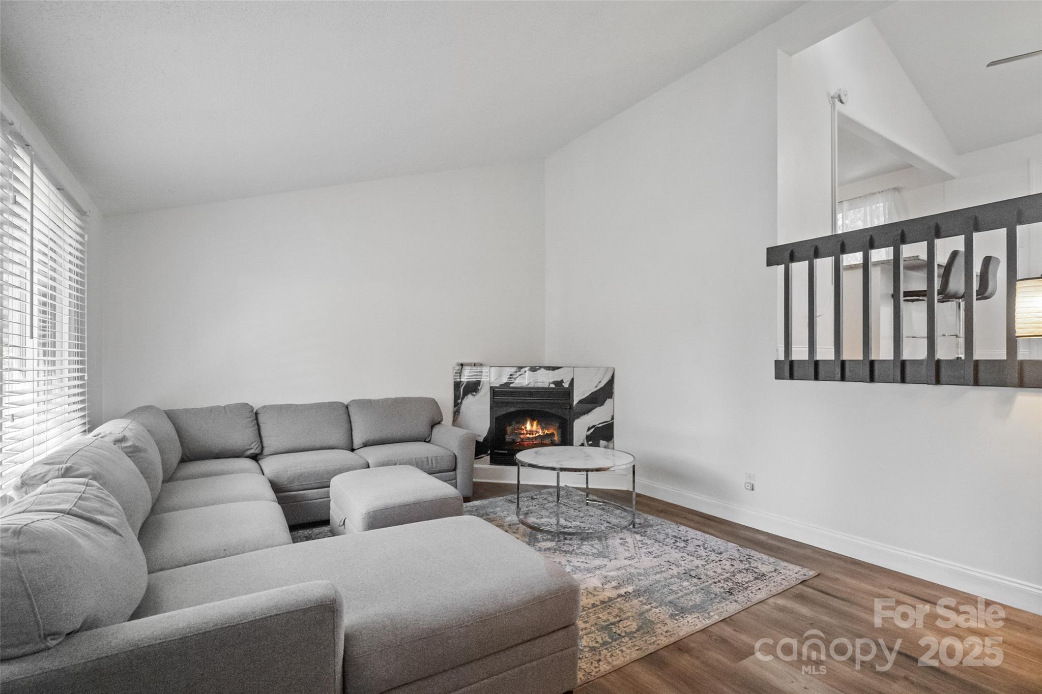 5709 Shadow Creek Road Charlotte, NC 28226 - Photo 5 of 39 a living room with furniture and a rug