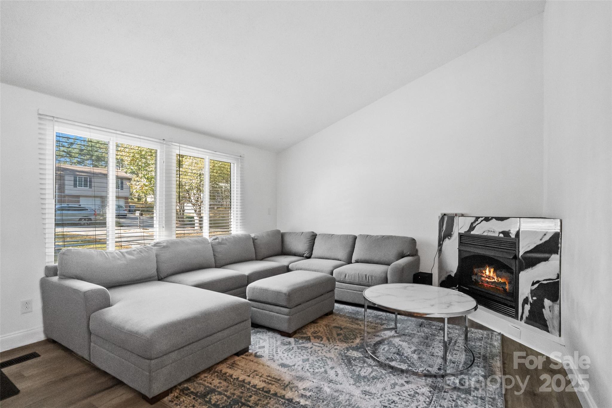 5709 Shadow Creek Road Charlotte, NC 28226 - Photo 6 of 39 a living room with furniture and a window