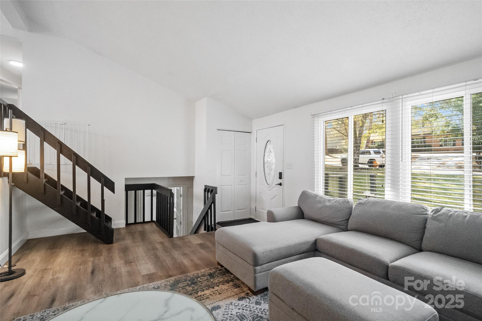 5709 Shadow Creek Road Charlotte, NC 28226 - Photo 7 of 39 a living room with furniture and a window