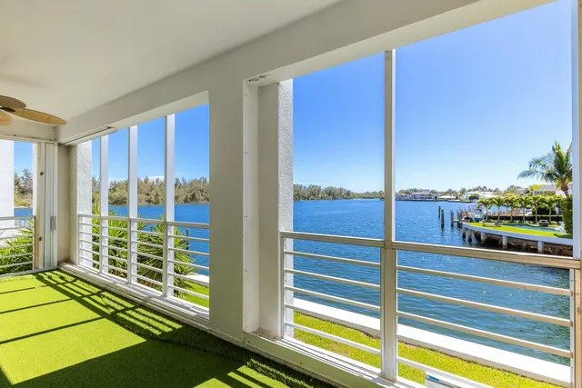 a view of a living room and balcony