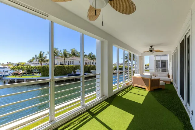a view of a chairs and table in a balcony