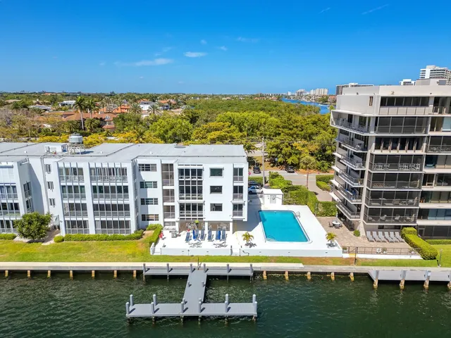 a view of building with swimming pool and outdoor space