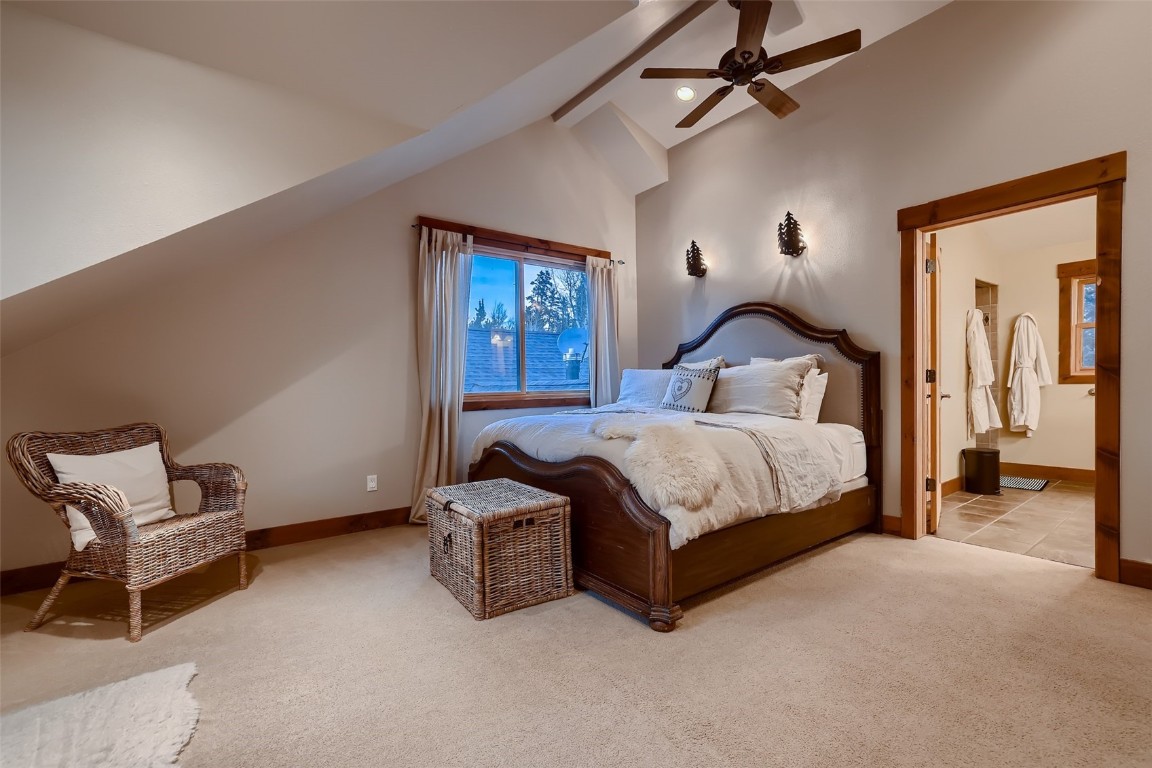 490 Adventure Road Alma, CO 80420 - Photo 20 of 28 Carpeted bedroom with ceiling fan, beamed ceiling, ensuite bathroom, and high vaulted ceiling