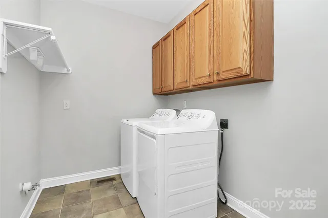 a bathroom with a granite countertop sink toilet and a mirror