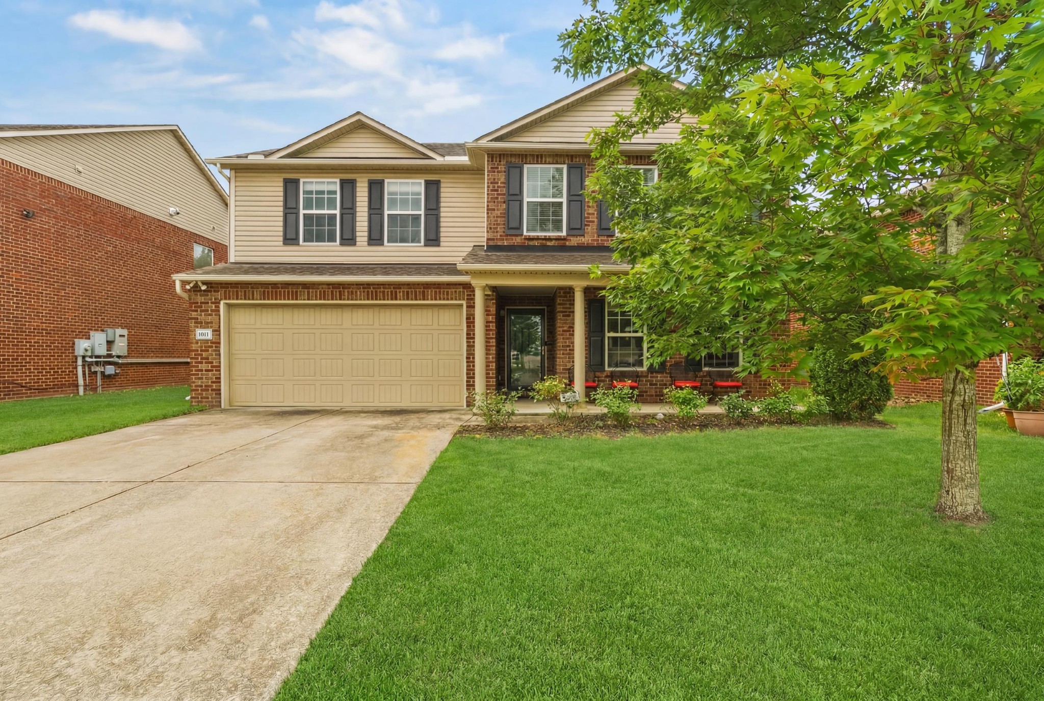 1011 Benwick Road Hendersonville, TN 37075 - Photo 1 of 60 a front view of a house with a yard and trees