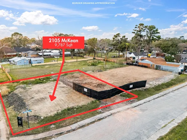 a sign board with buildings in the background