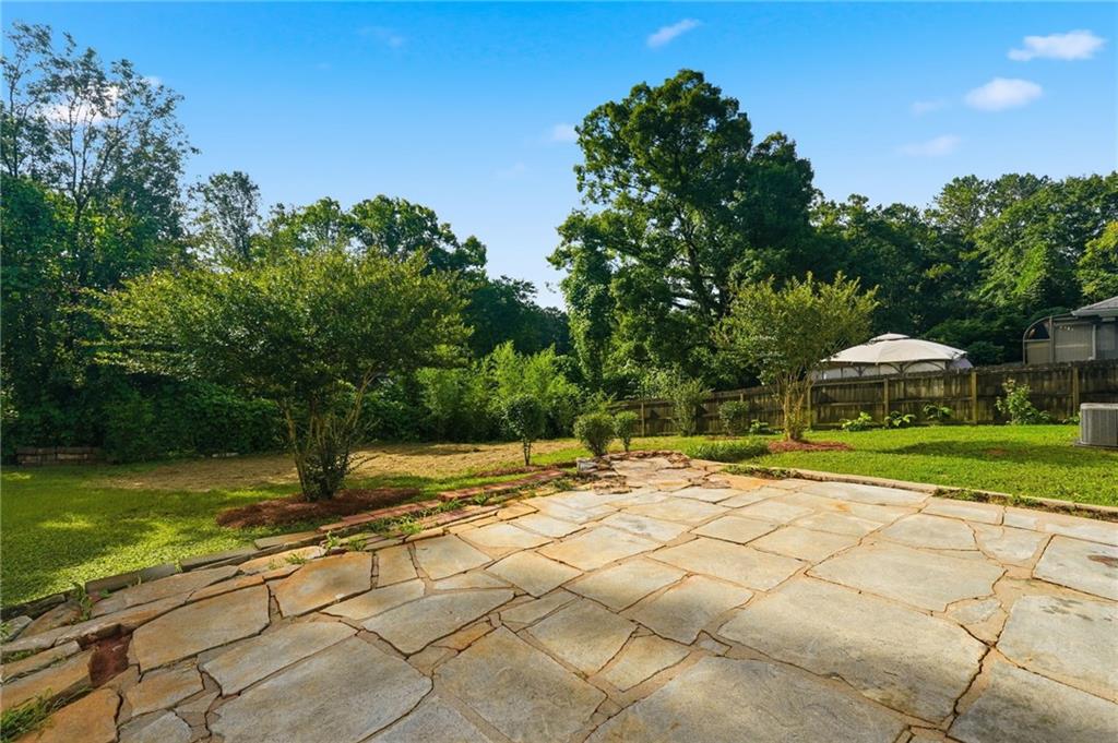 2118 Glendale Drive Decatur, GA 30032 - Photo 21 of 23 a view of a yard with plants and trees
