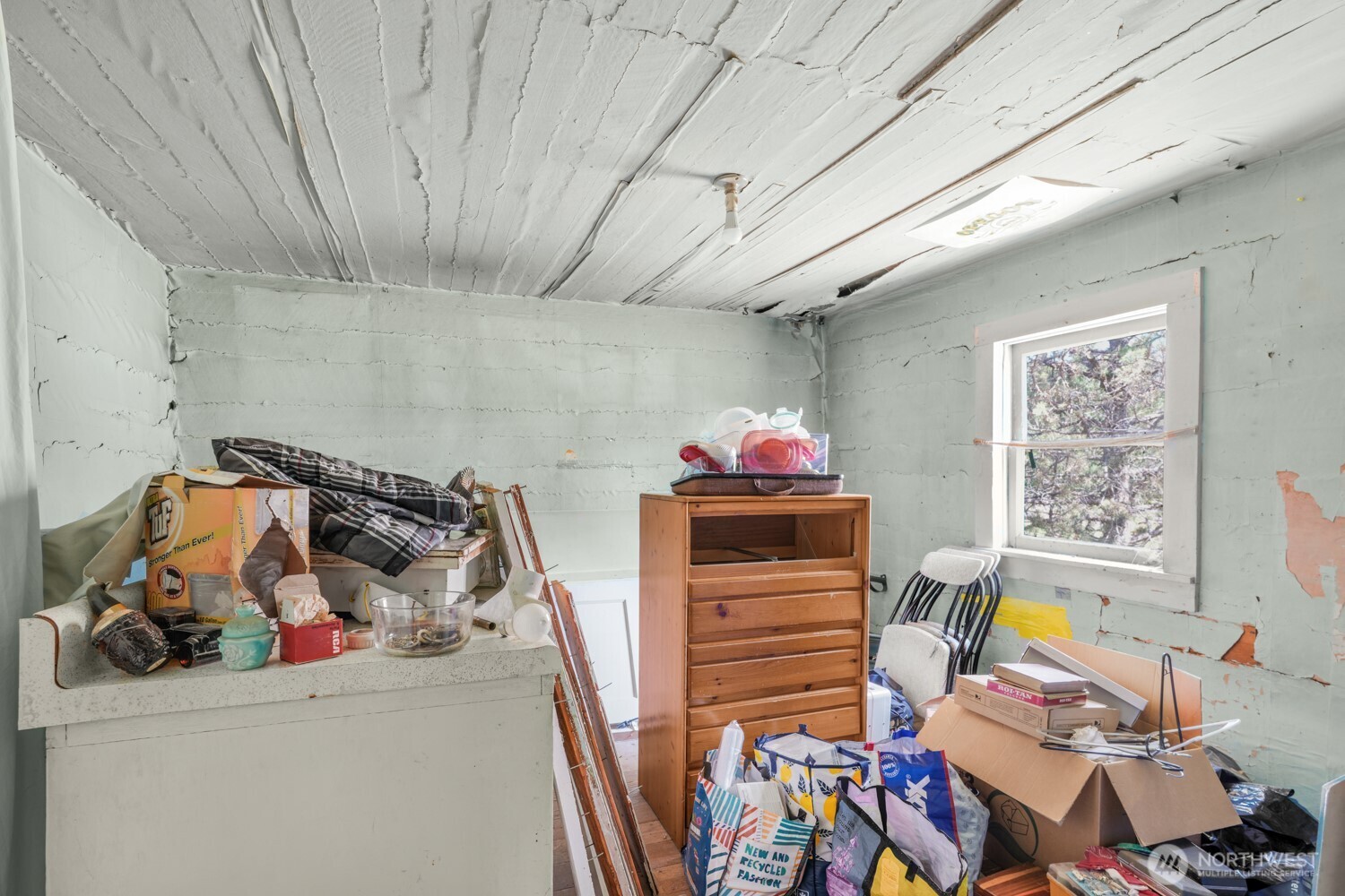 3220 Bickleton Highway Roosevelt, WA 99356 - Photo 7 of 17 a storage room with furniture and a chandelier
